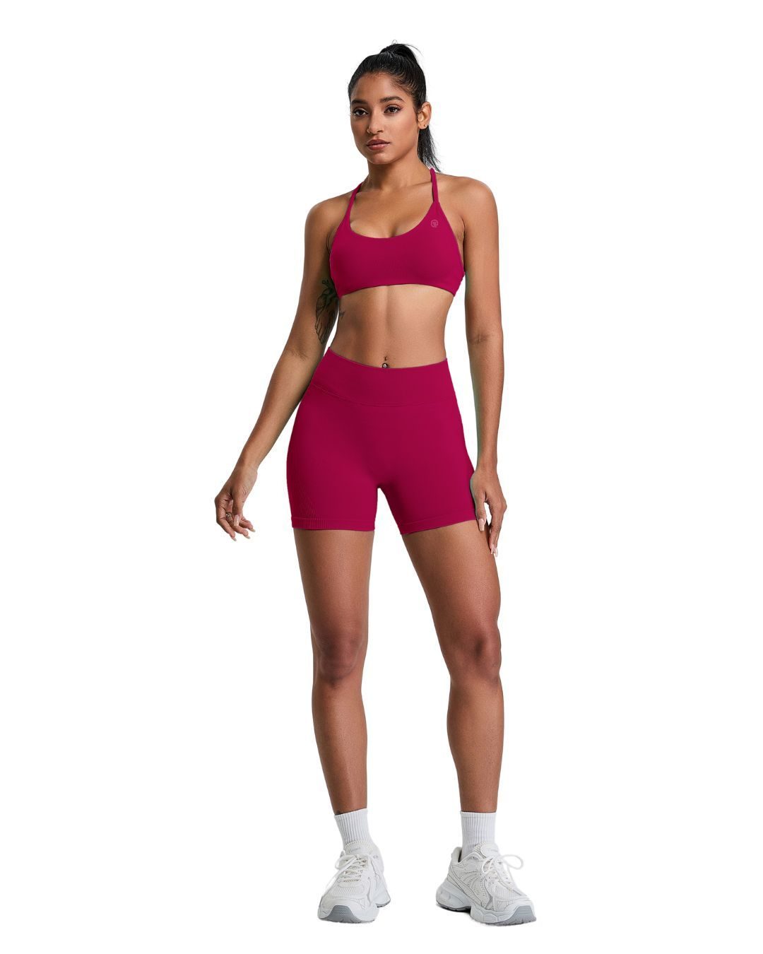 Woman wearing magenta ORU Elura Short with high-rise waistband and 4-way stretch fabric designed for active movement