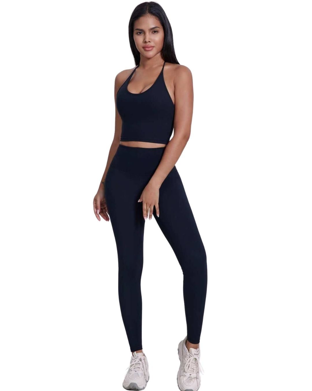 Woman wearing black ORU LEGACY LEGGINGS with ultra high rise and butterfly 3-seam back waistband detail