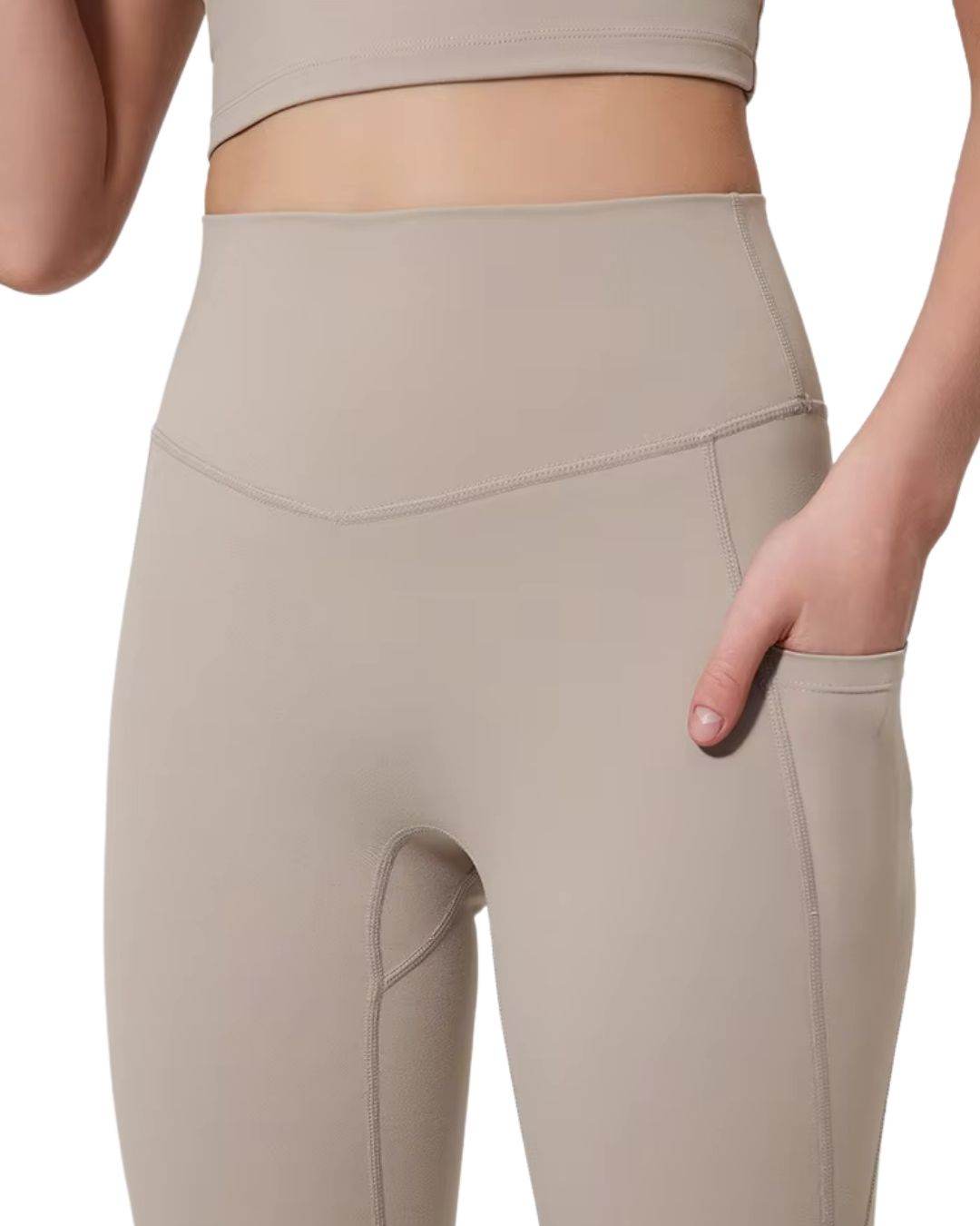 Beige ORU COZY POCKET LEGGINGS with high waist and side pocket for small essentials, made of lightweight, stretchy, breathable fabric for comfort and support.