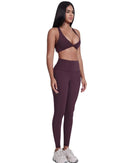 woman wearing maroon ORU Legacy Leggings with ultra high rise and butterfly 3-seam back waistband detail