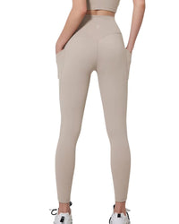Beige ORU COZY POCKET LEGGINGS with high waist, side pockets, and firm compression for hip shaping and comfort.