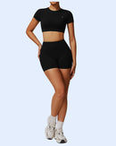 Woman wearing black ORU Phul Short with mid rise and elasticated waistband for comfort