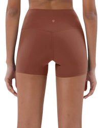 Back view of ORU Mid-Rise Yoga Shorts in brown with high stretch and subtle glute contour design
